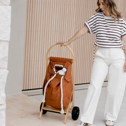 The Nimble Cart in clay brown next to sara