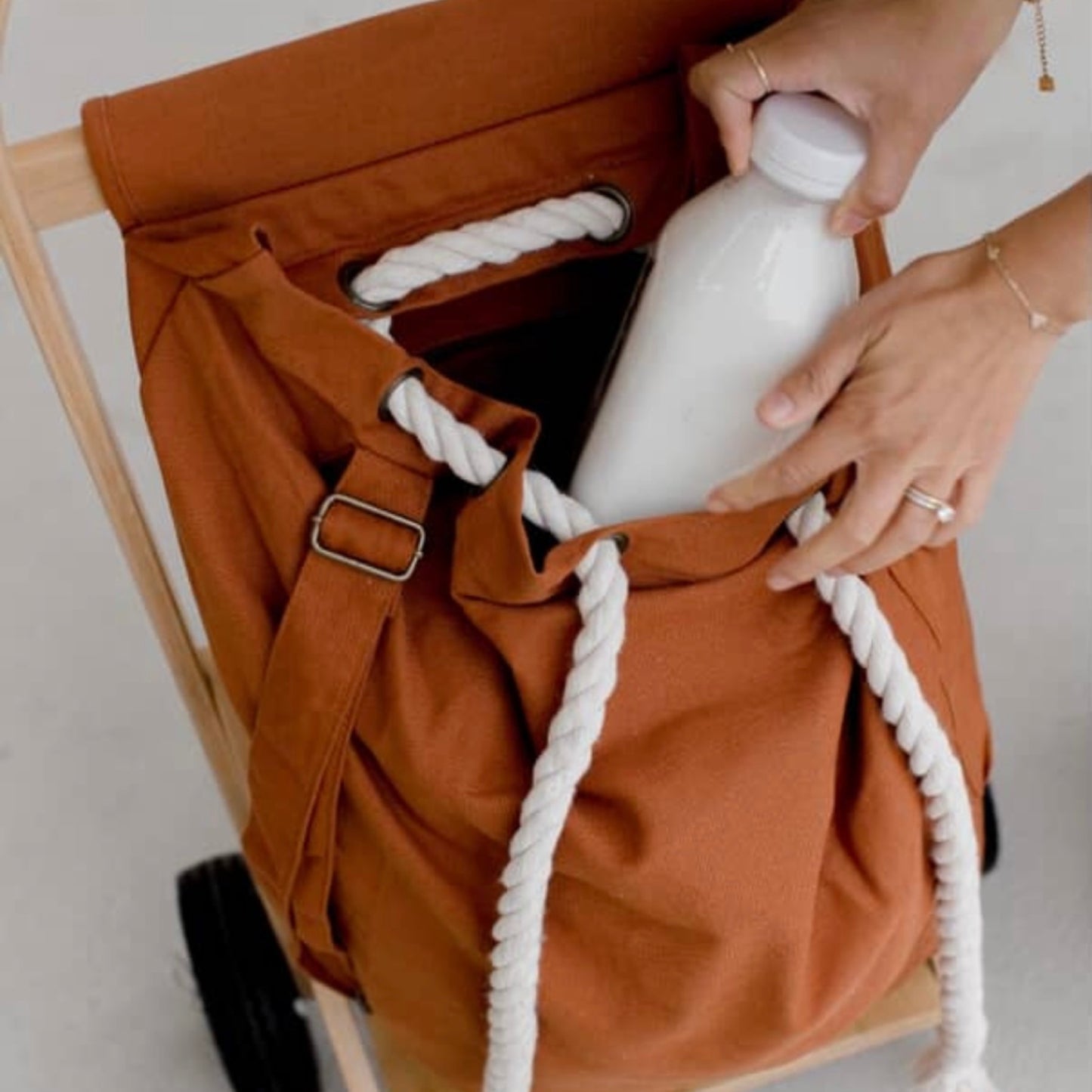 The Nimble Cart in clay brown being loading with groceries