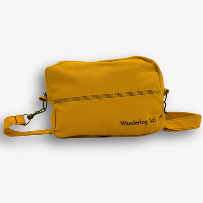 Front view of Wattle Yellow Crossbody Bag by Wandering Sol showing detachable strap – made from recycled canvas with removable strap, can be worn as a clutch or shoulder bag.