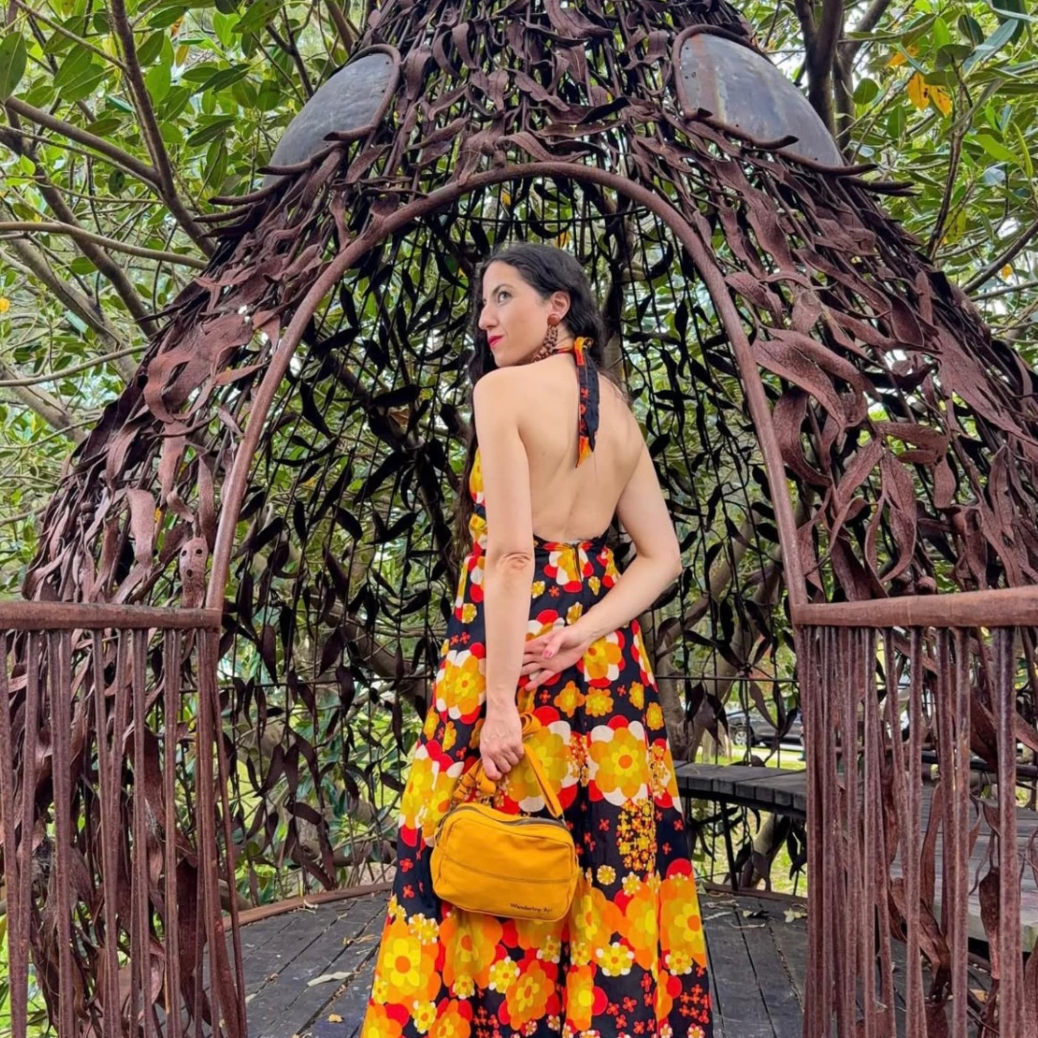 Wandering Sol Crossbody being used as a clutch in Wattle Yellow