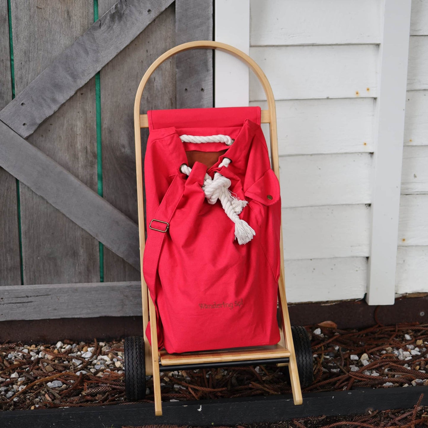 The Nimble Cart by Wandering Sol in Pilbara Red alongside the house gate