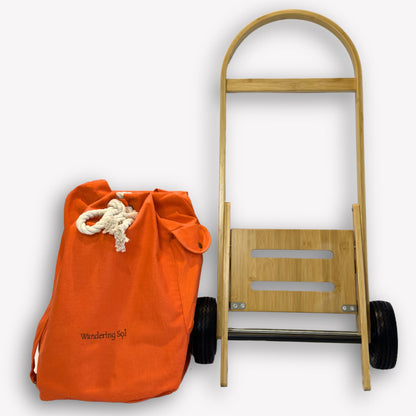 Nimble Market Cart folded flat for storage – compact bamboo frame with Sunset Orange canvas bag removed