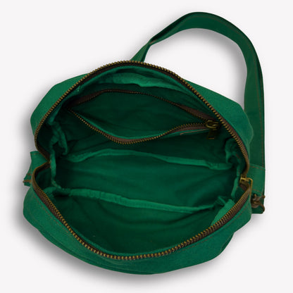 Inside view of Emerald Green Crossbody Bag by Wandering Sol showing large phone sized inner pocket – made from recycled canvas with removable strap, can be worn as a clutch or shoulder bag.